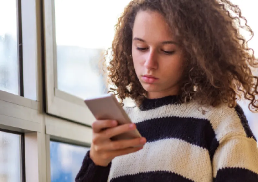 young person on a phone