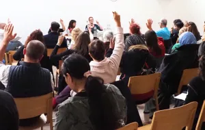 audience raising hands at food summit