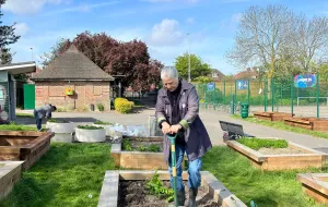 one person gardening in a park 