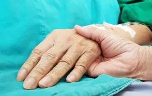 A hand on another hand.