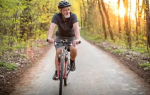 A man enjoying a bike ride in the woods