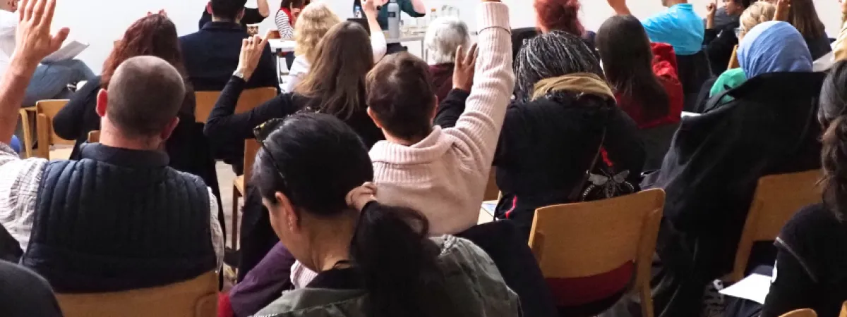 audience raising hands at food summit