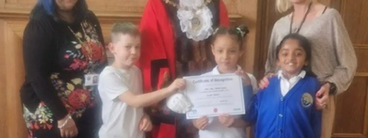 Pupils and staff receiving award from the Mayor of Barnet