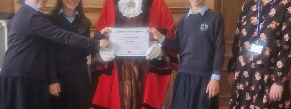 Pupils and staff receiving award from the Mayor of Barnet