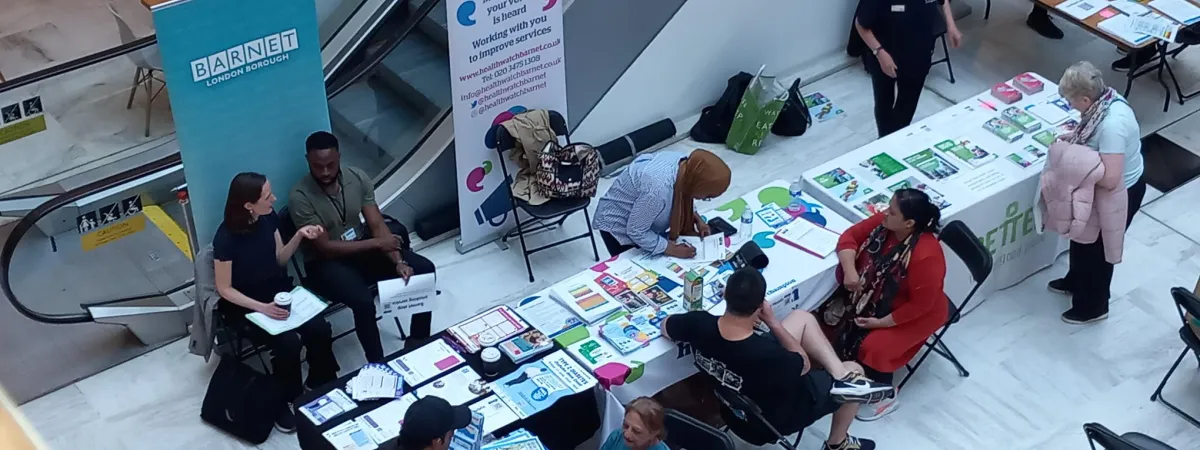 Picture of stallholders talking to residents at the diabetes week event