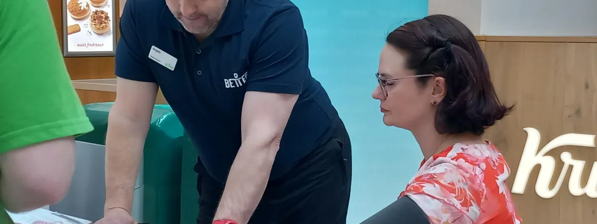 A person receiving a blood pressure check